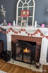 A fireplace in a living room filled with furniture and a fire place