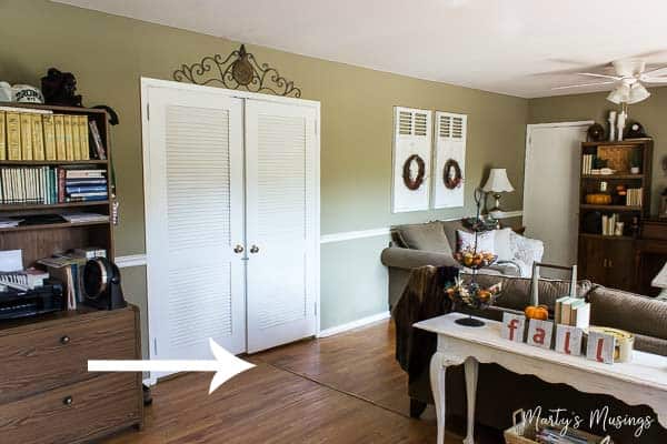 A living room filled with furniture on top of a hard wood floor