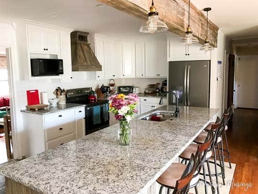 A kitchen with an island in the middle of a room