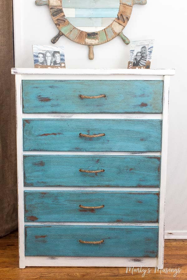 old dresser chalk painted with aqua and white with beach decor