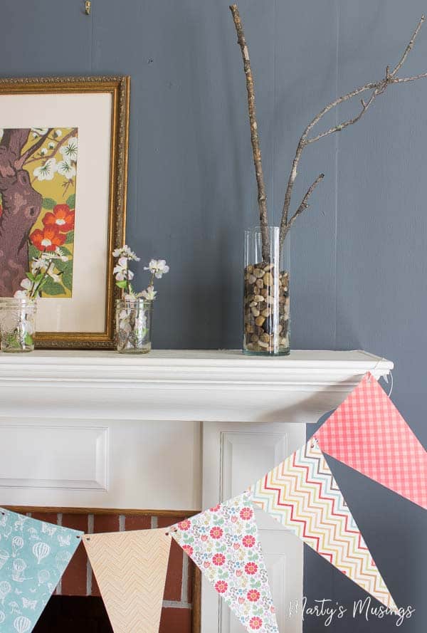 Think you have no time or money to create a beautiful home? Not true! This easy spring banner from scrapbook paper can be done in minutes and costs pennies!