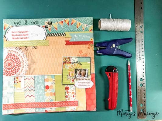 Think you have no time or money to create a beautiful home? Not true! This easy spring banner from scrapbook paper can be done in minutes and costs pennies!