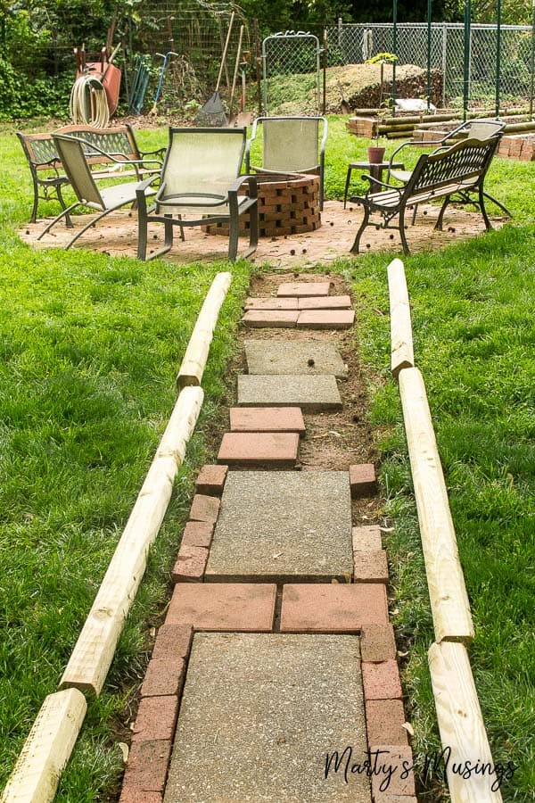 A group of lawn chairs sitting on top of a wooden fence