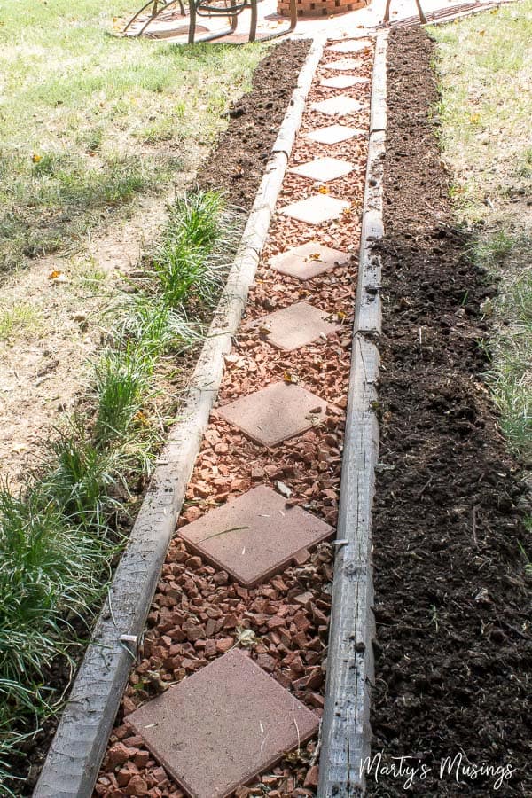 A yard with grass and dirt