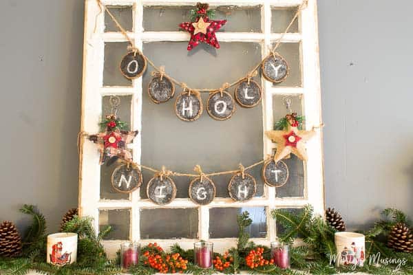 Old window hung with chalkboard O Holy Night banner