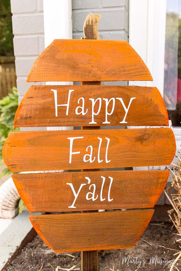 Orange wood pumpkin with happy fall y'all on it