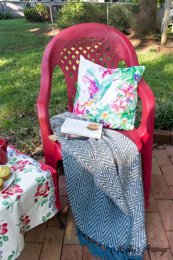 cozy spray painted chair outside with snacks
