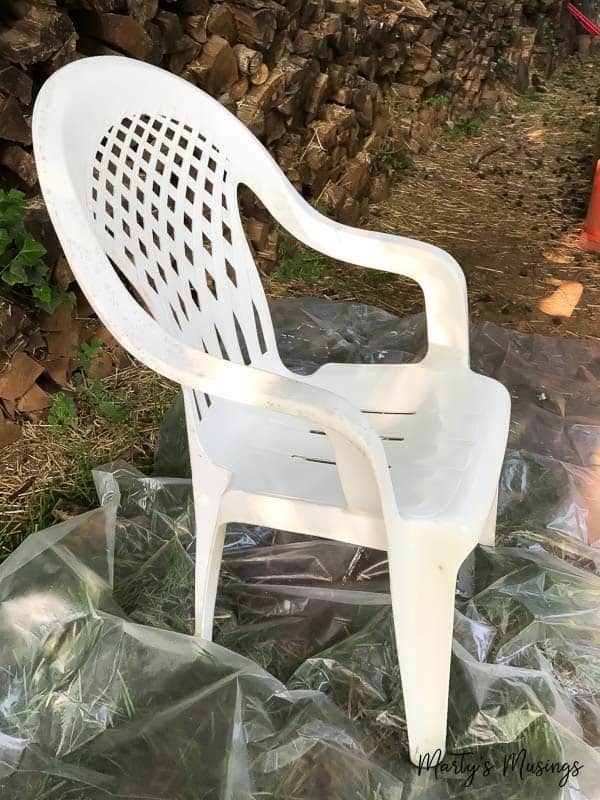 Dingy white plastic chair outside