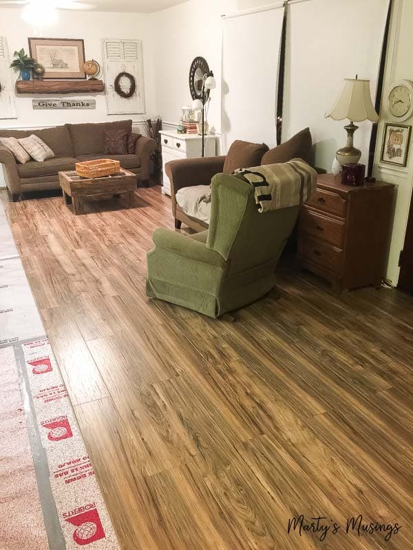 A living room with a wooden floor