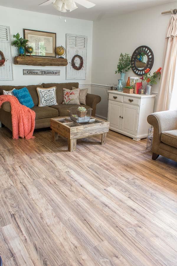 A living room filled with furniture on top of a hard wood floor