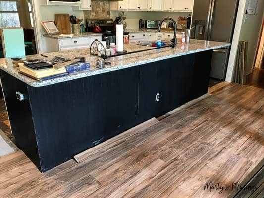 A kitchen with a wood floor