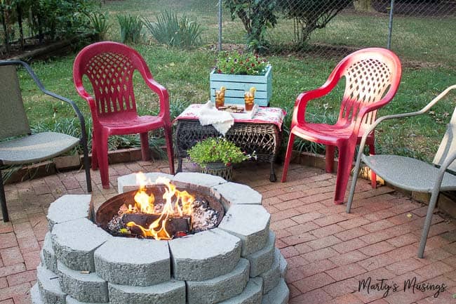 A couple of lawn chairs sitting on top of a picnic table