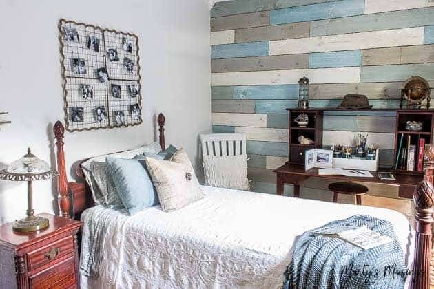 Create a soothing coastal bedroom retreat with these inexpensive DIY beach decor ideas including a plank wall and yard sale treasures!