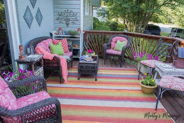 A living room filled with pink flowers on a table