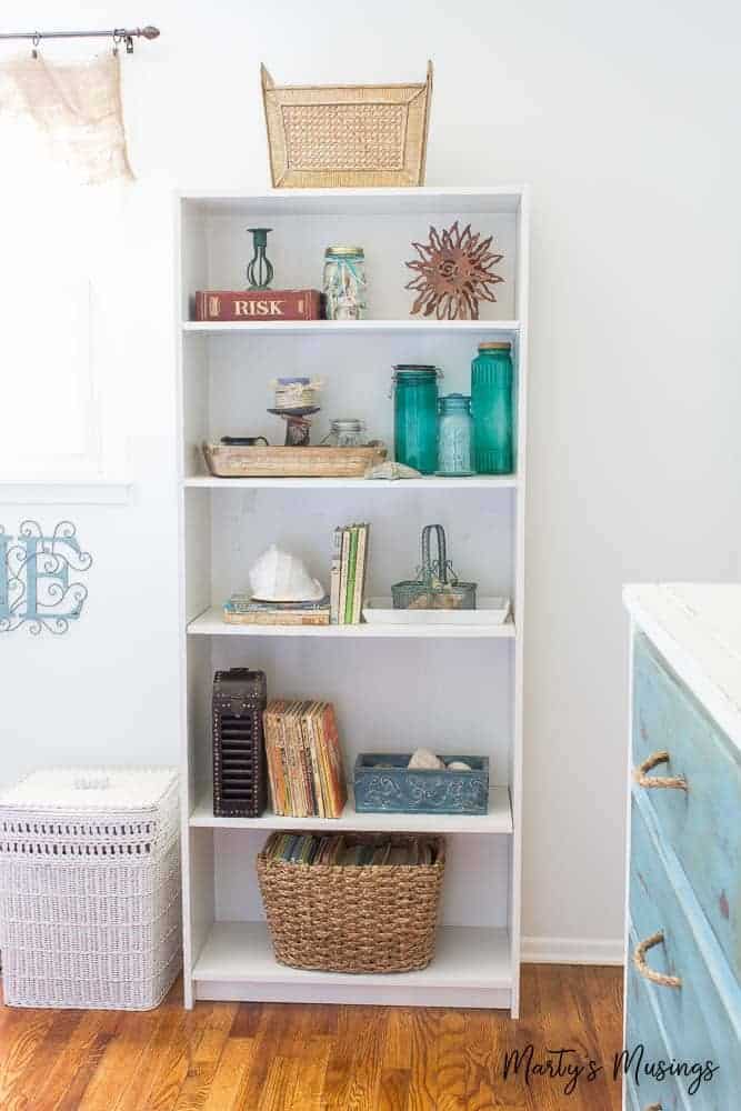White shelving unit with beach accessories