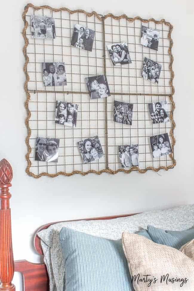 Metal wall hanging filled with black and white pictures