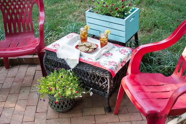 A couple of lawn chairs sitting on top of a picnic table