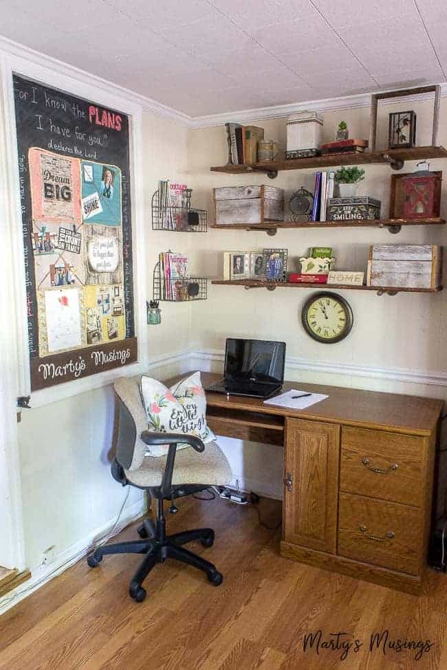 Carve out a space in your small home office nook for an easy DIY bulletin board using scrapbook paper, chalkboard paint and your creativity!