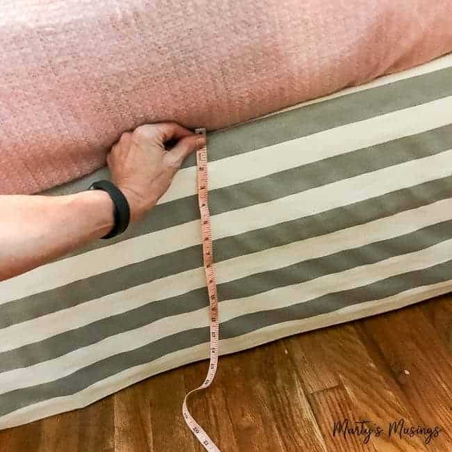 Don't know how to sew but still want a beautiful, inexpensive bedroom? Learn how to pull it all together with this easy no sew DIY bed skirt tutorial, pictures included!