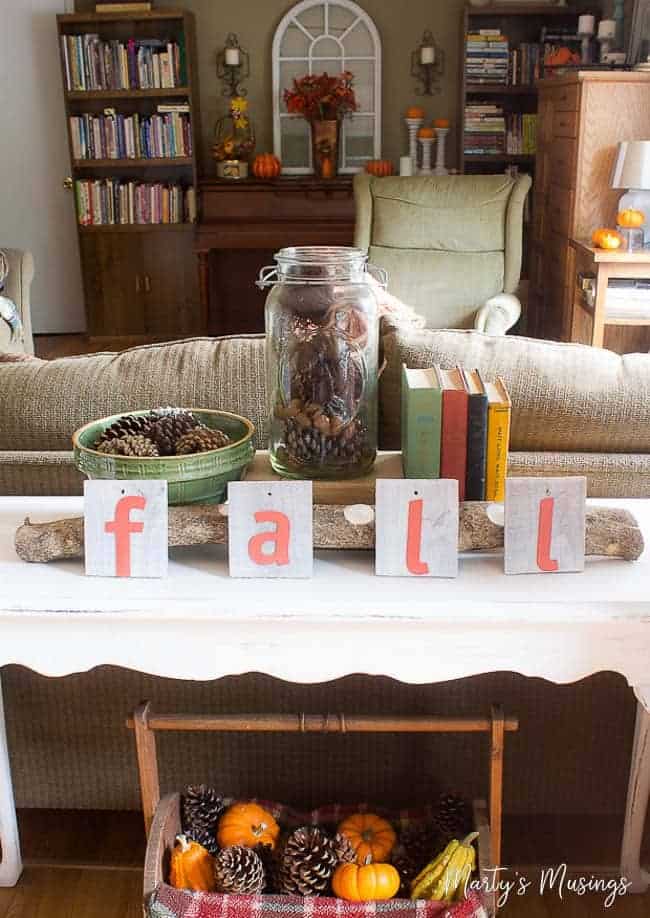 A living room filled with furniture and vase on a table