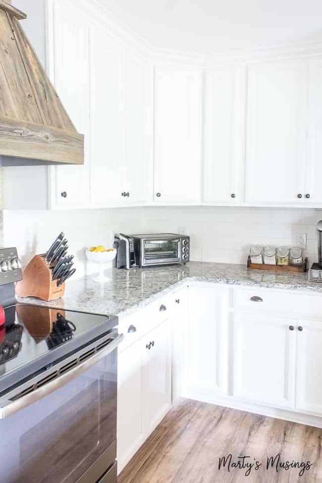 A kitchen with stainless steel appliances and wooden cabinets