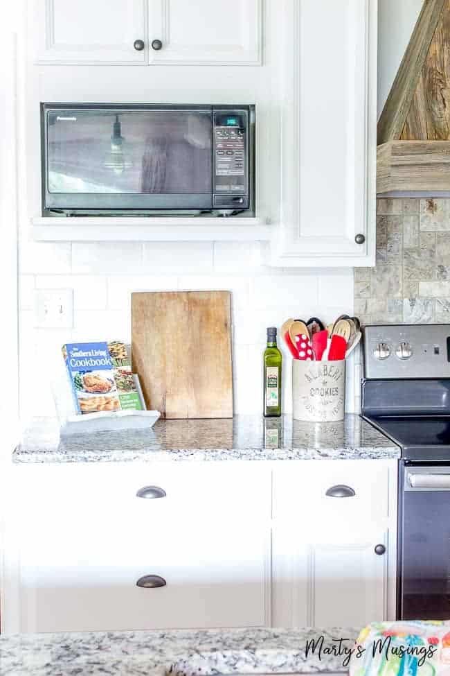 White kitchen cabinets with granite countertops