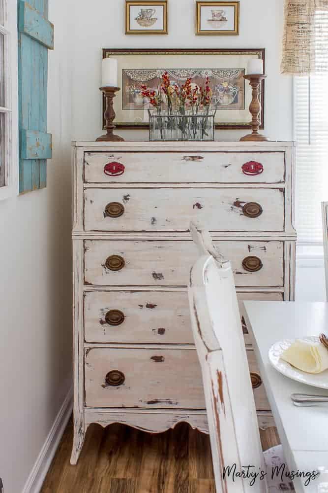 A kitchen with a sink and a mirror