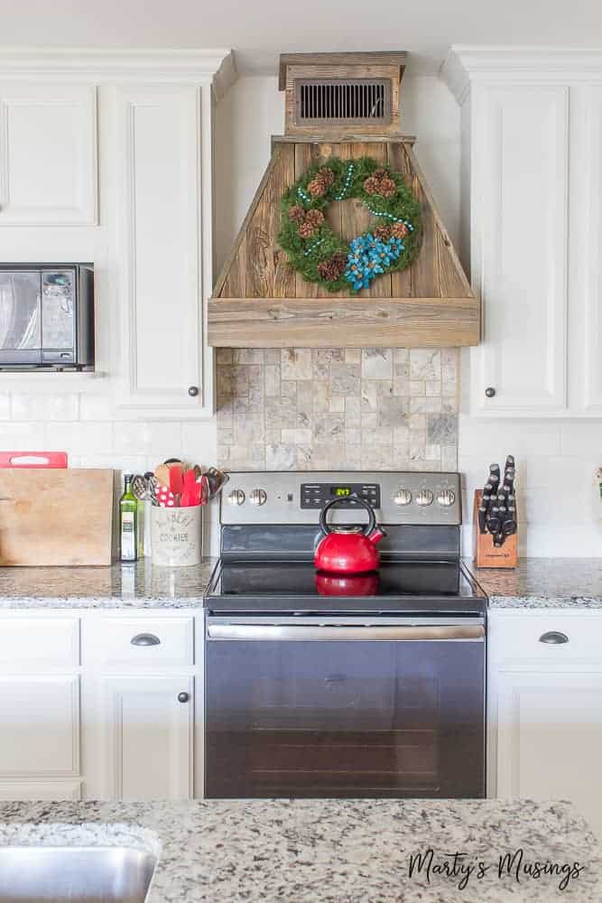 This rustic Christmas kitchen decor is simple to pull together using aqua and red accents for a pop of color and easy, thrifted accessories!