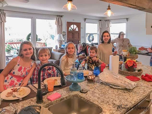 A group of people sitting at a table posing for the camera