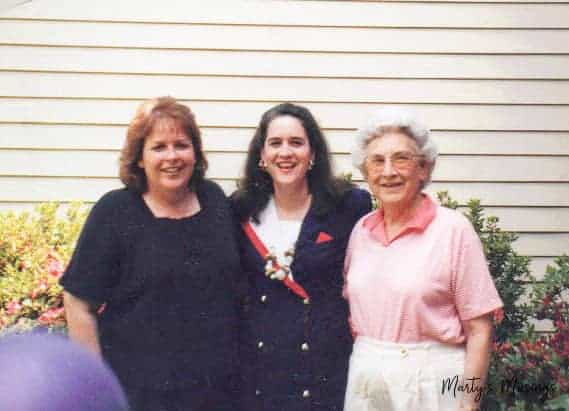 A person standing in front of a group of people posing for the camera