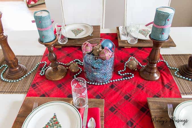 buffalo plaid table runner with blue decorations for Christmas