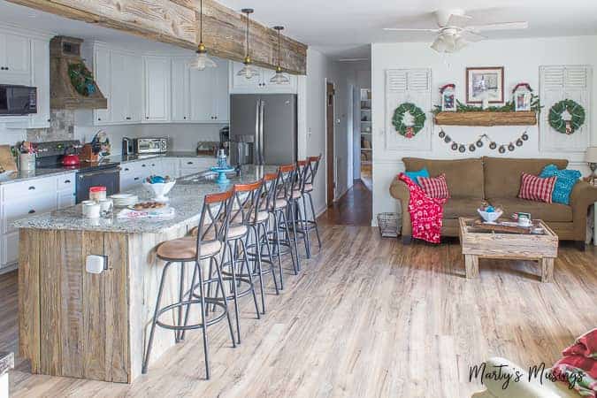 A kitchen area with wooden wheels in a room