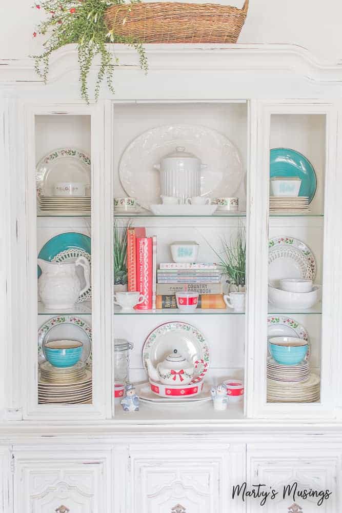 White china hutch with aqua and red accents