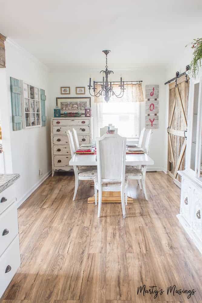 A living room filled with furniture on top of a hard wood floor