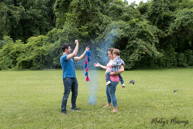 A group of people playing frisbee in a park