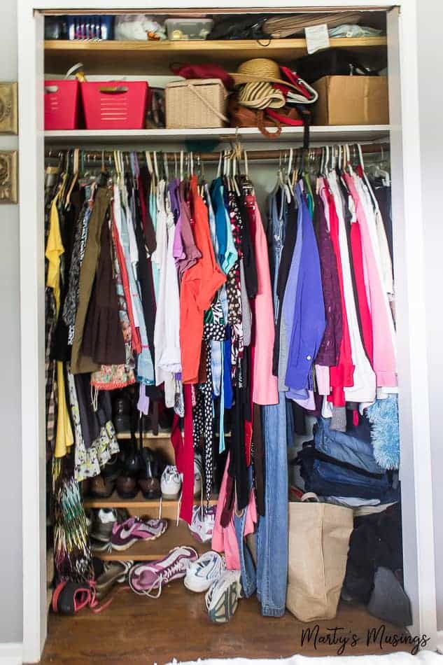 Woman's closet with messy storage for clothes