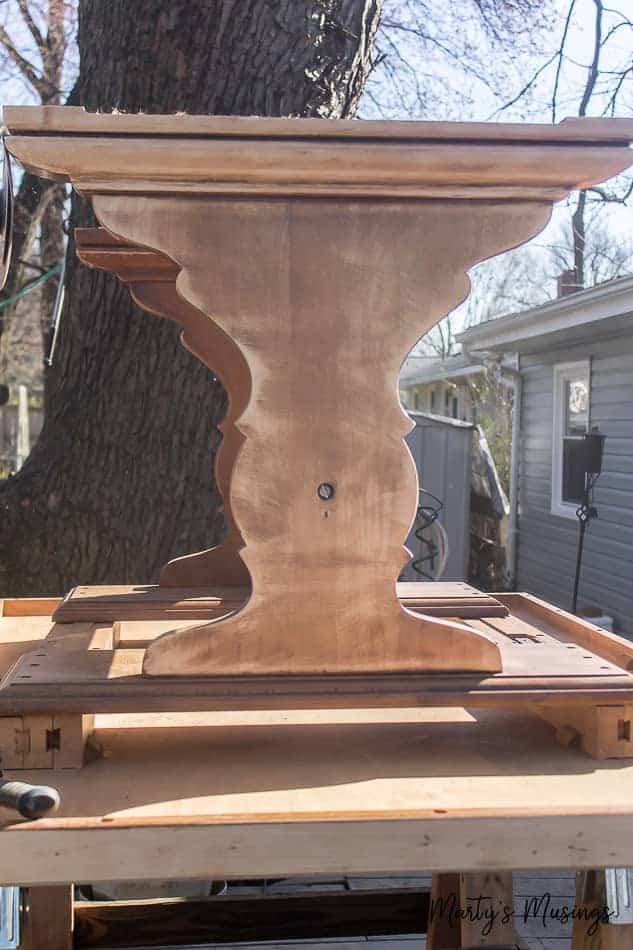 farmhouse table outside prepped for painting