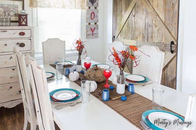 A kitchen with a table in a room