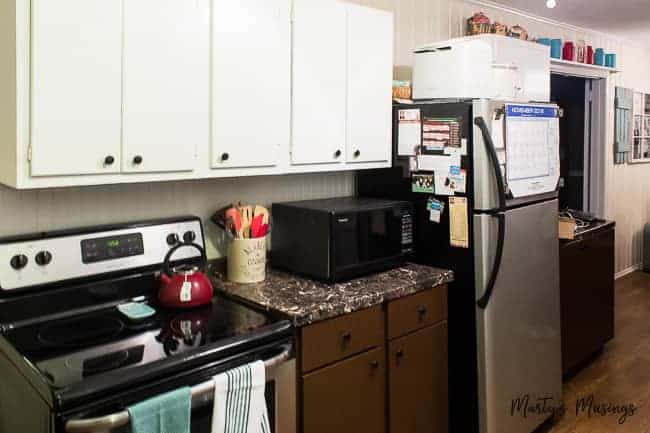 Before picture of galley kitchen in dated ranch style home