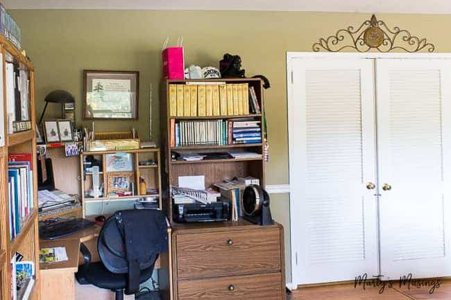 A desk with a book shelf