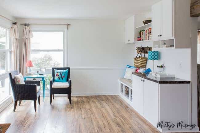 A living room filled with furniture and a large window