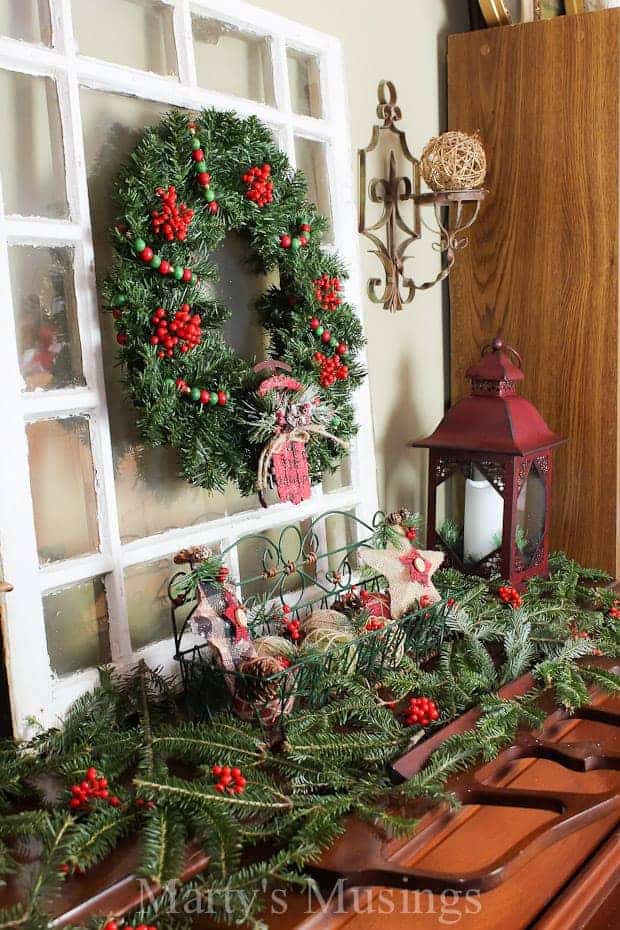 How to decorate a pretend mantel with evergreens and repurposed items.