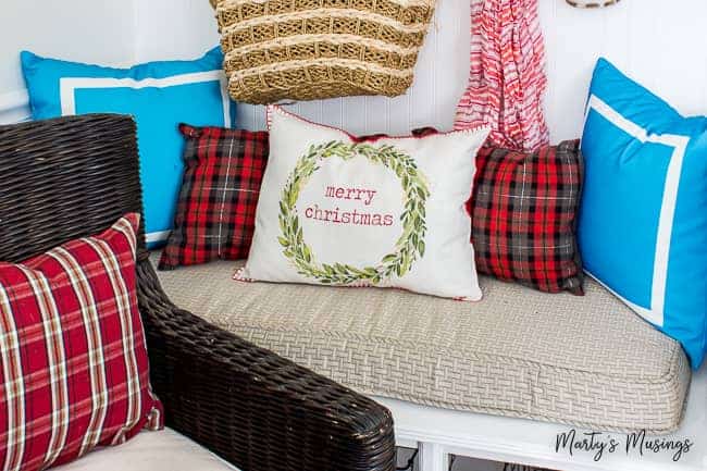 Merry Christmas pillow with red plaid and aqua accent pillows