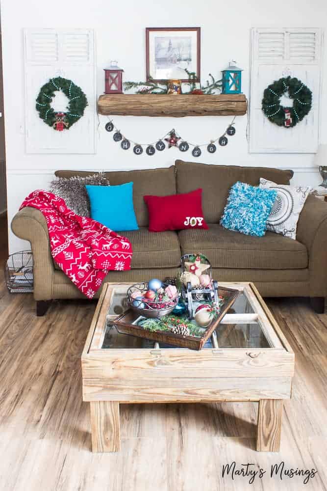 rustic Christmas home with red and aqua accents in the living room