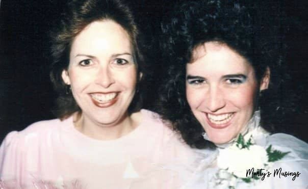 two sisters celebrating at wedding