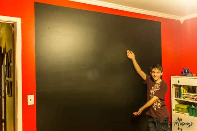 large chalkboard wall on top of red painted room