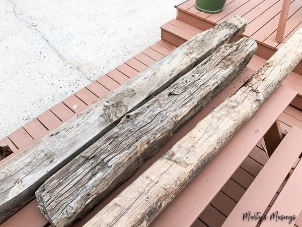 barn wood logs on top of a deck
