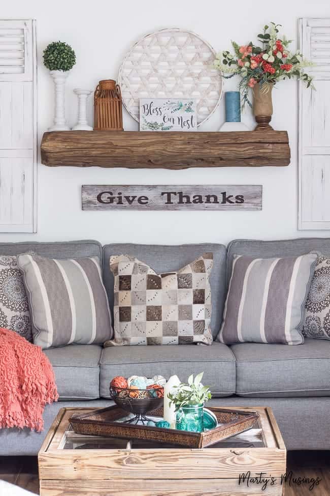 A living room filled with furniture and vase on a table