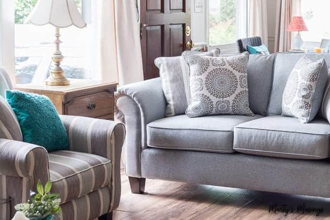 A living room filled with furniture and a large window