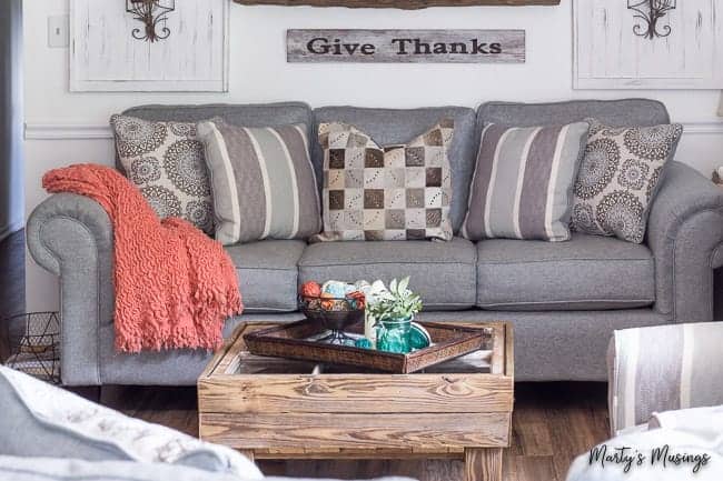 A grey sofa in a living room